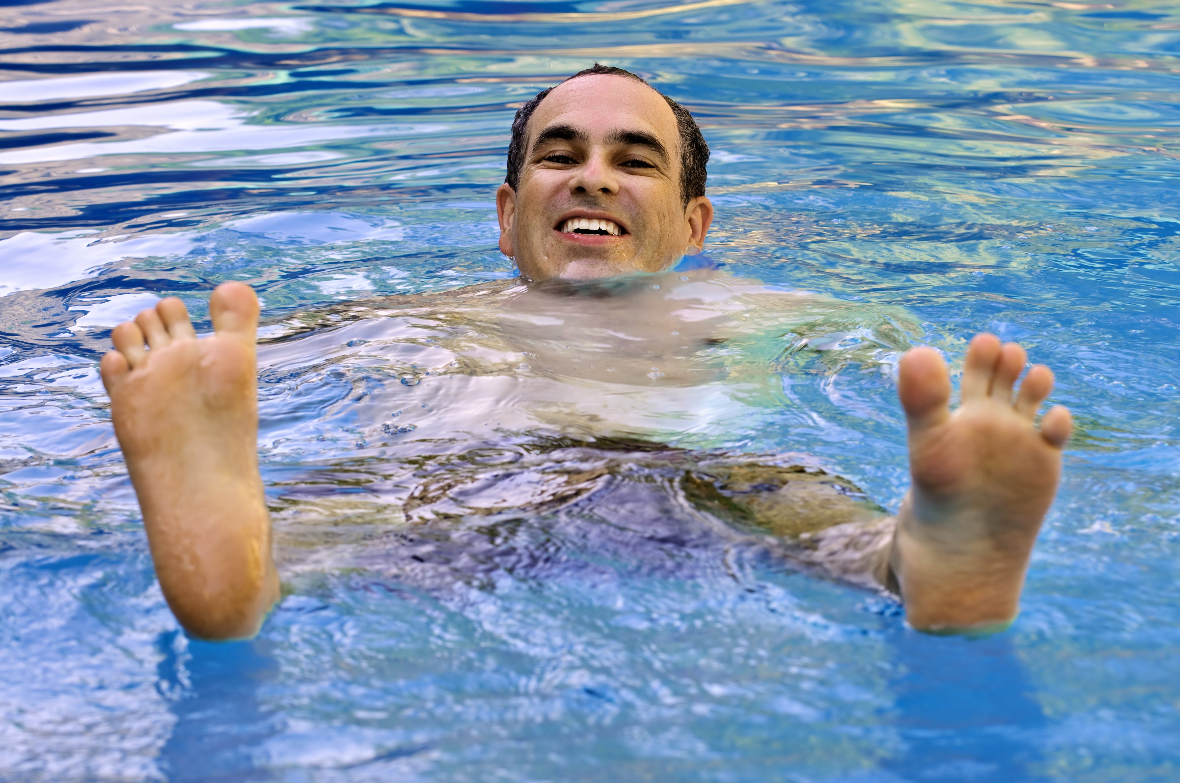 Man floating weightlessly in Epsom salt float pod at Shropshire Floatation and Wellness Centre